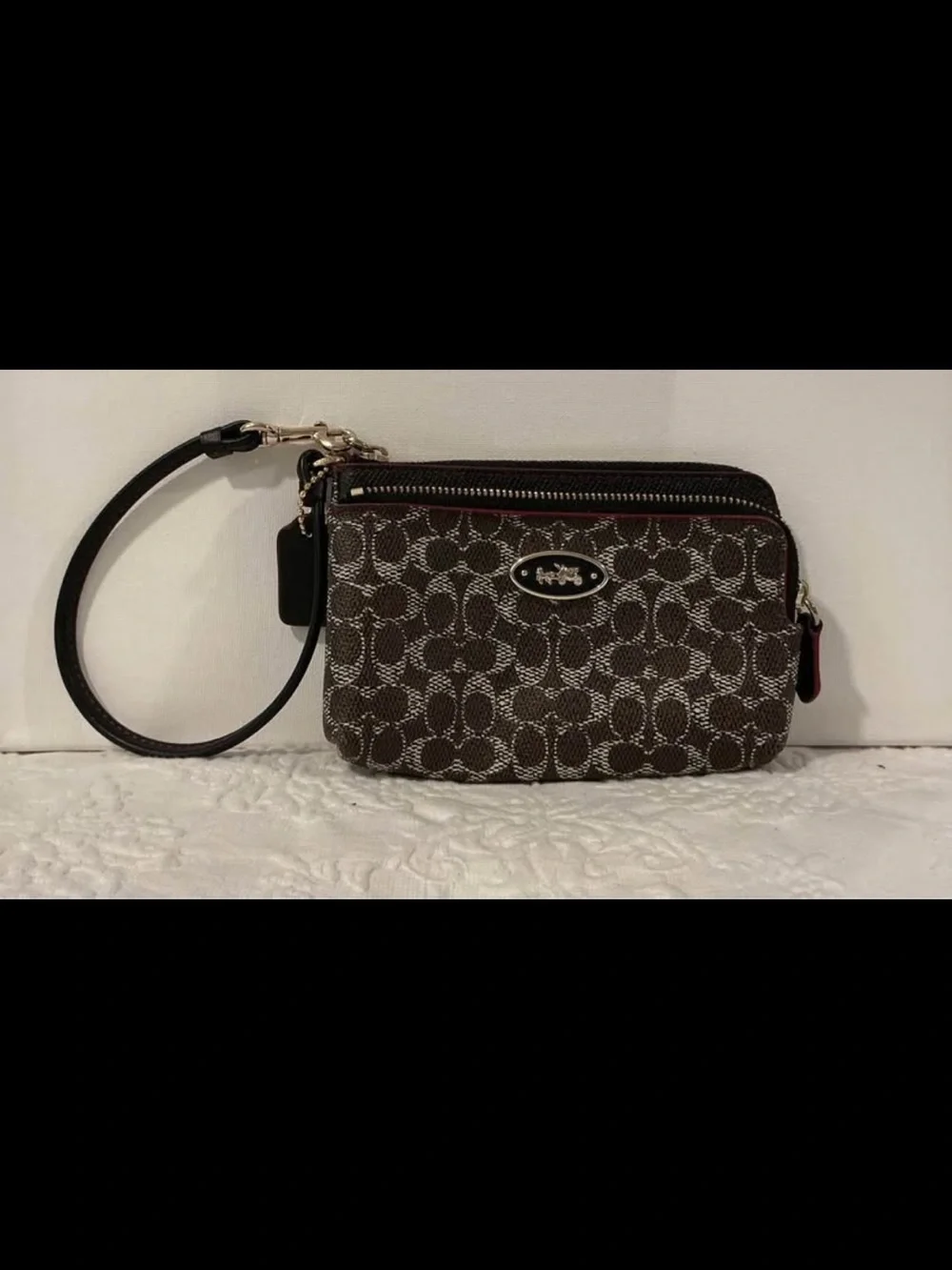 Brown and Black Coach wristlet